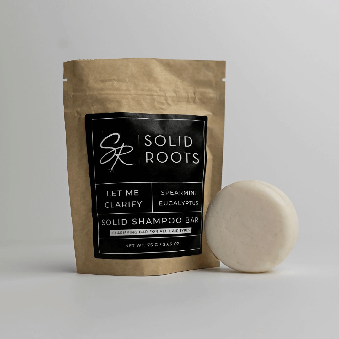 Image of a white shampoo bar next to its packaging
