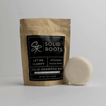 Load image into Gallery viewer, Image of a white shampoo bar next to its packaging
