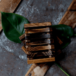 Load image into Gallery viewer, Image of two wooden shower dishes on greenery
